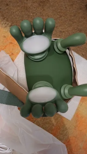 Close-up of the two massage heads of the Nodly massager and their ten green silicone fingers